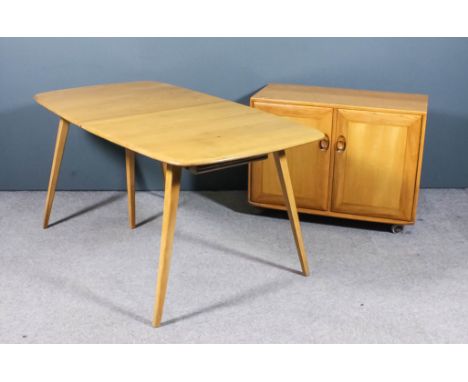 A modern Ercol elm and beech rectangular extending dining table with one extra fold-out leaf, on four splayed legs, 60ins ext