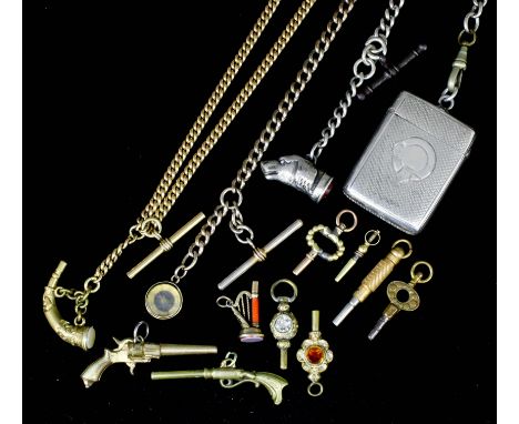 A silver Albert, the silver dogs head seal inset with carnelian, and with silver vesta case attached with engine turned front