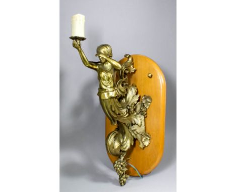 A late 19th/early 20th Century brass and gas light wall bracket cast and finely chiselled as a Neo-classical maiden emerging 