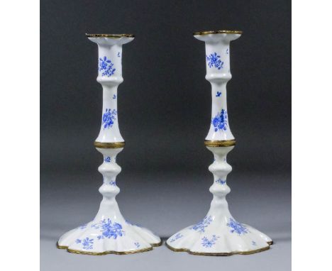 A pair of George III blue and white enamel and gilt brass mounted pillar candlesticks with sexfoil sconces, knopped stems and