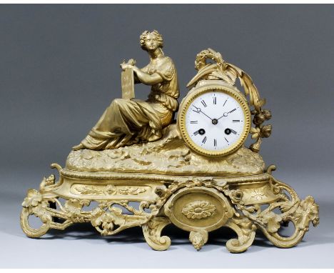 A late 19th Century French gilt metal cased mantel clock, the 3.25ins diameter white enamel dial with Roman numerals, to the 