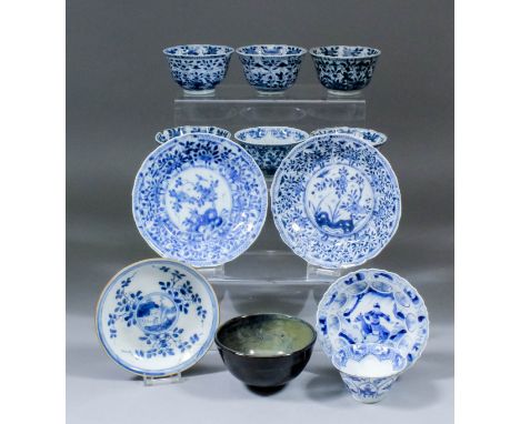 Six Chinese blue and white porcelain tea bowls, all variously painted with flowers in shaped panels, each 3.375ins (8.5cm) di