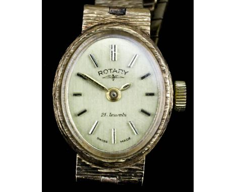 A lady's 9ct gold Rotary wristwatch, the oval gilt face with baton numerals in rectangular pattern case, 18mm x 15mm overall 