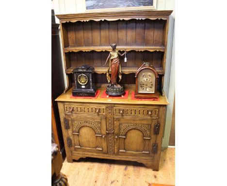 Carved oak shelf back two door dresser, 178.5cm by 122cm.