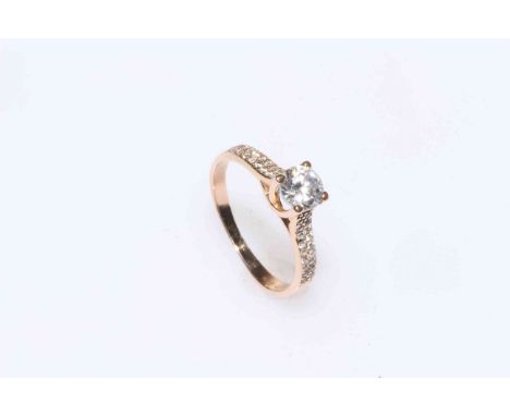 18 carat gold and white stone set ring, size M.