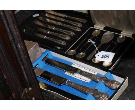 Cased silver coffee spoons, silver napkin ring, silver handled tea knives and serving knives.