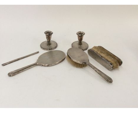 A pair of silver engine turned decorated dressing table candlesticks; and various other dressing table items