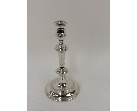 A modern silver single candlestick, of baluster shape, loaded base, London (date letter rubbed), 26cm high 