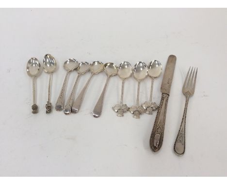 Four Georgian silver condiment spoons; a Victorian silver Christening fork and spoon; and five various silver souvenir teaspo