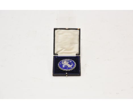 A Sterling silver and blue enamel decorated brooch, by George Jensen, circa 1970's