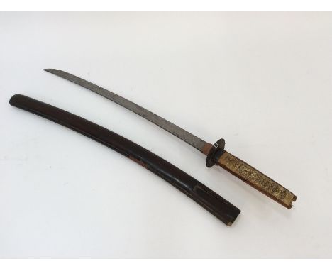 A Japanese short sword, in lacquered scabbard, having pierced Tsuba and shagreen grip, AF, blade 52.5cm long