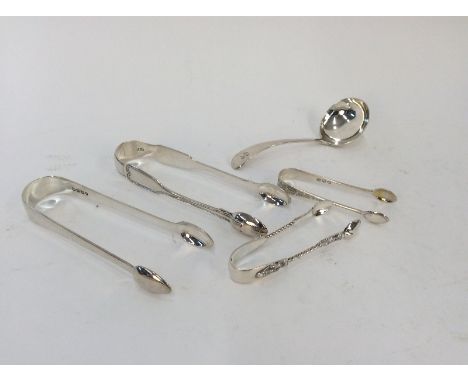 A pair of George IV silver sugar tongs, of plain form, London 1827; a pair of Victorian silver sugar tongs; a silver sauce la