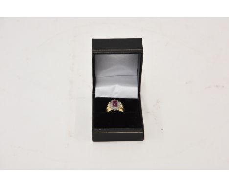 A 14 carat gold ruby and diamond set ring