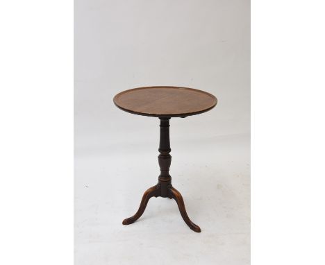 A 19th Century mahogany tripod table, with circular dished top, raised on a turned baluster column, 52cm dia.