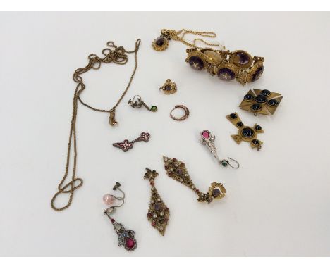 A yellow metal enamel decorated and red cabouchon set pendant, hung to a fine link chain with 15 carat gold barrel clasp; a y