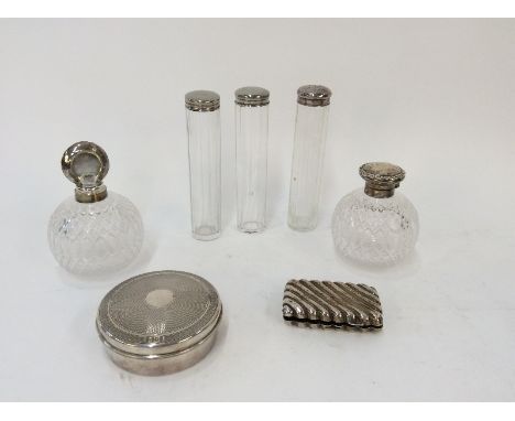 A pair of cut glass and silver mounted globular scent bottles, London 1908; circular silver powder bowl with engine turned de