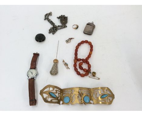A silver vesta case, Birmingham 1892; a filigree pendant hung to a white metal chain; an Art Deco gilt metal and turquoise se