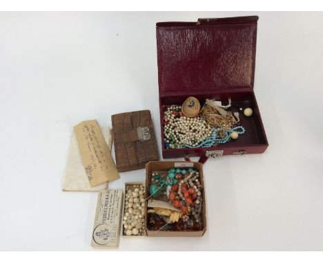 A leather cased trinket box; and two other boxes and contents of various beads etc.