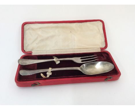 A George II rat-tail spoon, bearing initials AC & NM, date letters indistinct, possibly 1723; and a similar three tine fork, 