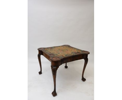A walnut and cross banded card table, in the 18th Century style, the foldover rounded corner top opening to reveal a needlewo