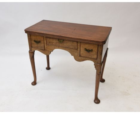 A mahogany card table, in the 18th Century manner, the foldover top opening to reveal a baize lined interior with sunken coun