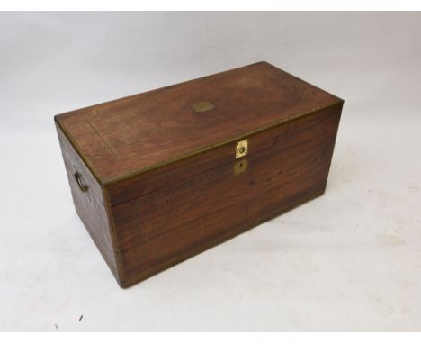 A 19th Century hardwood and brass campaign trunk, flanked by carrying handles with sandlewood lined interior, 104cm wide 