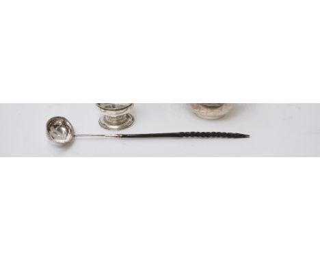A Georgian silver toddy ladle, the oval bowl inscribed J E Bird, with whalebone twist handle 