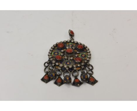 A white metal, enamel and coral mounted cloak ornament