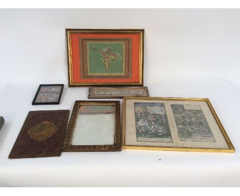 A Persian papier mâché mirror, with lift out panel decorated scenes of animals and foliage, heightened in gilt, 36.5cm x 24cm