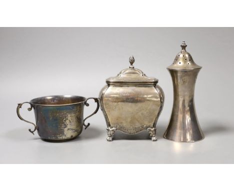 A late Victorian silver bombe shaped tea caddy, Nathan &amp; Hayes, Chester, 1899, height 12.7cm, a later silver waisted suga
