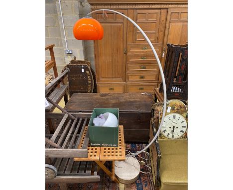 A 1960's adjustable chromium arc floor lamp with orange shade, height 175cm and a spare white shade