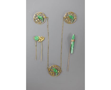 A yellow metal and jade mounted three section circular cloak? brooch, each jade carved as a bird, each section diameter 25mm,