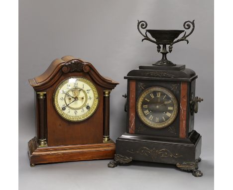 A 19th century slate urn mantel clock with lion feet, together with an American column mantle clock, tallest 41cm