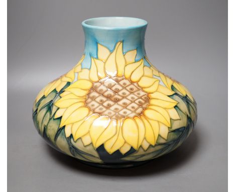 A Moorcroft pottery vase of compressed form, decorated in the "Sunflower" pattern, 20cm