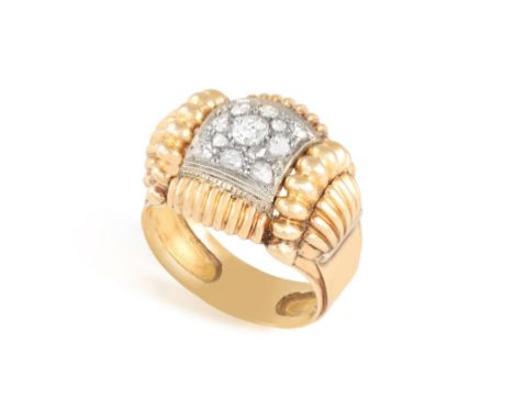 A DIAMOND RING, CIRCA 1950Of bi-coloured design, set to the centre with rose-cut diamonds, with millegrain-detailing, within 