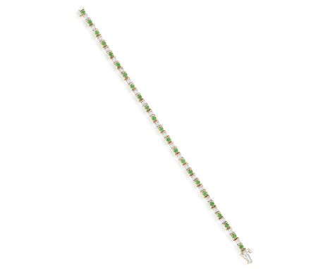 AN EMERALD AND DIAMOND BRACELETOf bi-coloured design, the single line set with circular-cut emeralds and single-cut diamonds,