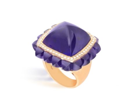 AN AMETHYST AND DIAMOND RINGSet with a buff-top amethyst, within a brilliant-cut diamond surround, to a similarly-cut amethys