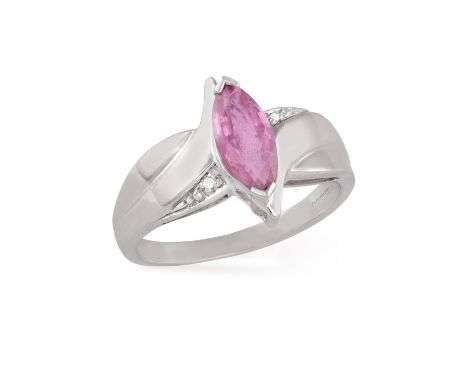 A PINK SAPPHIRE AND DIAMOND RINGSet with a marquise-shaped pink sapphire, within a stylised polished mount, highlighted by si