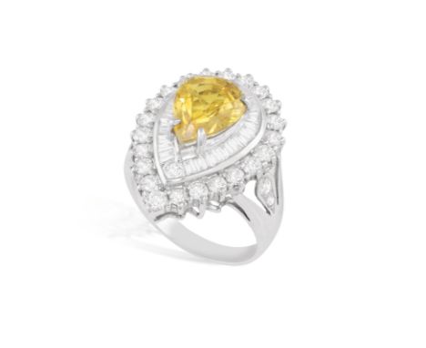 A YELLOW SAPPHIRE AND DIAMOND RINGOf pear-shaped design, set with a pear-shaped yellow sapphire weighing approximately 4.70 c