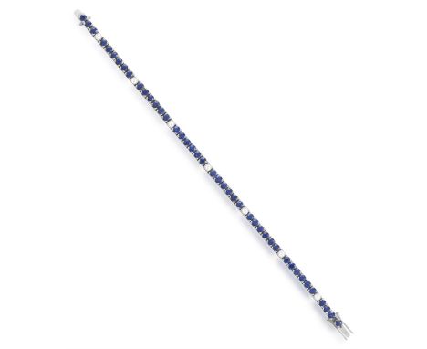 A SAPPHIRE AND DIAMOND LINE BRACELETThe line-bracelet set with circular-cut sapphires and brilliant-cut diamond spacers, moun