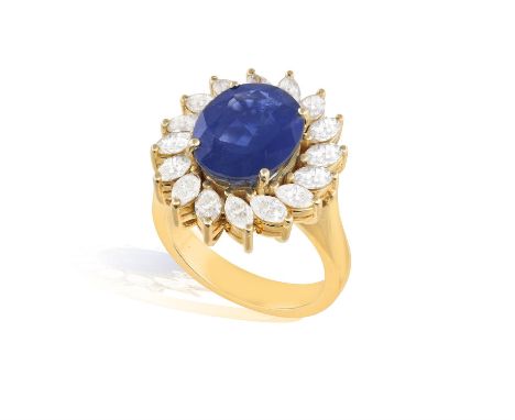A SAPPHIRE AND DIAMOND RINGSet with an oval-shaped sapphire, within a scrolled surround of marquise-shaped diamonds, mounted 