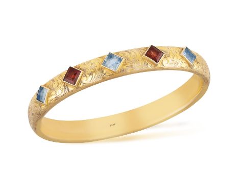 A GEM-SET BANGLEOf rigid-design, set to the front with four square-shaped citrines and possibly aquamarines, with engraved fo