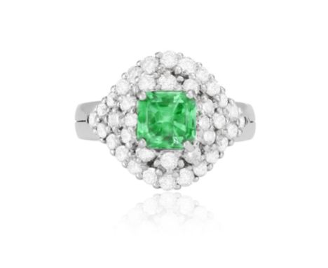 AN EMERALD AND DIAMOND RINGThe raised mount centring a square-shaped emerald weighing approximately 1.70ct, to a surround of 
