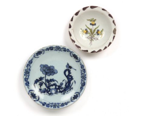 An early Dutch Delft saucer dish circa 1660-1680 21.5cm diameter together with a purple dash charger circa 1740 16cm diameter