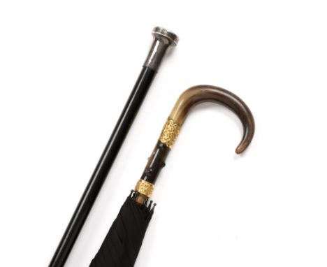 An early 20th century horn handled parasol with gilt mounts; together with a silver topped walking cane, 92cm in length