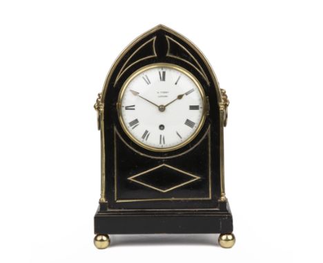 A mid 19th century ebonised mantle clock with brass decoration, the enamelled dial, signed W Terry London, 19cm wide 28cm hig