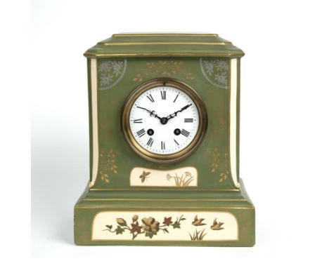A Macintyre and Co. pottery case mantel clock, the enamelled dial with roman numerals overall, 25.5cm wide 15cm deep 30cm hig