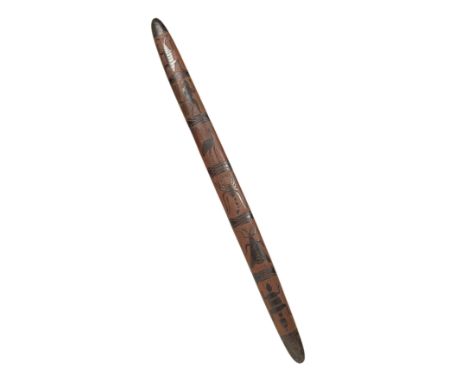 An early 20th century Australian Aboriginal Churinga, carved with insects, animals and figures 85cm in length.Provenance, Fie