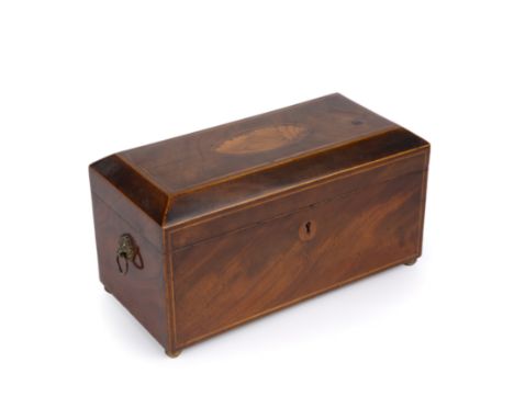 A George III walnut tea caddy with a satinwood shell inlaid top, lions mask handles and brass ball feet. 31cm wide 15cm deep 