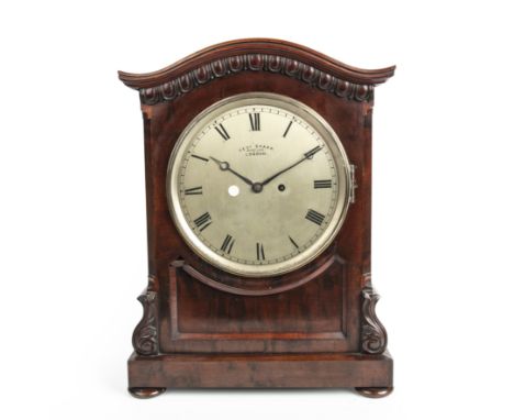 An early 19th century bracket clock by George Sharp having a silvered dial with Roman numerals and a mahogany case 34cm wide 